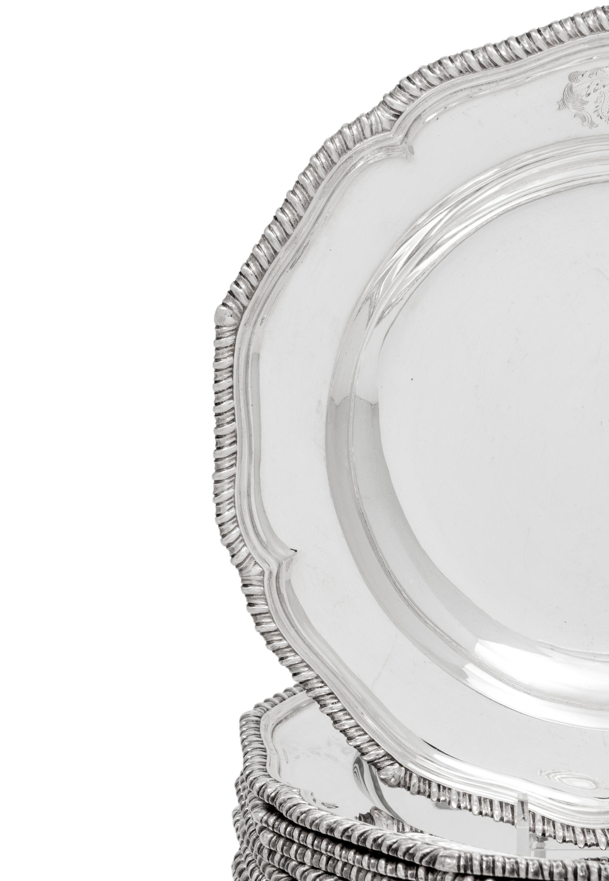 A Set of Twelve Silver Armorial Soup Plates