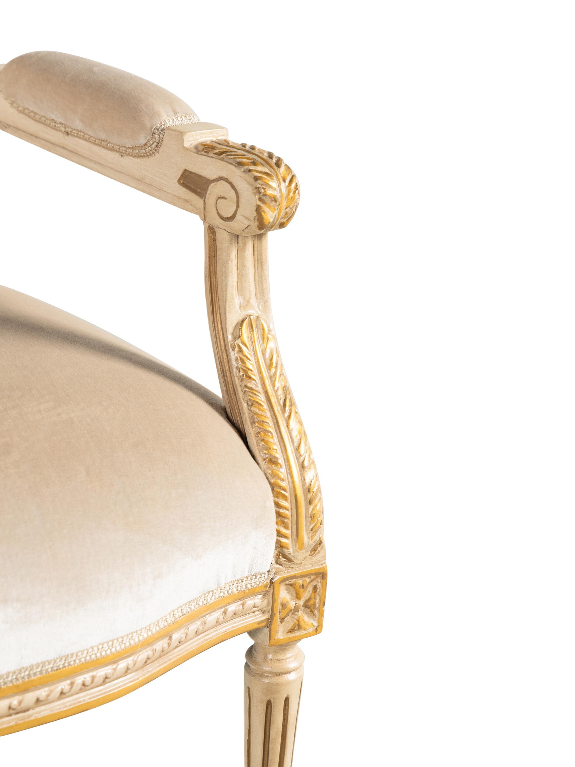 A Louis XVI Style Painted and Parcel Gilt Settee
