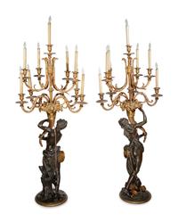 A Pair of Large Gilt and Patinated Bronze Figural Nine-Light Candelabra after the Models by Clodion