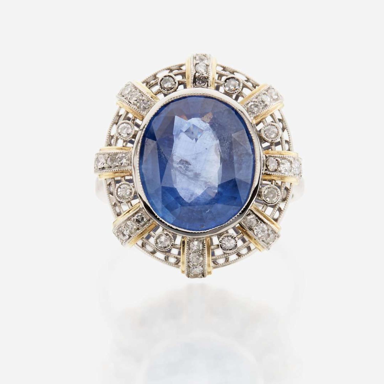 A sapphire, diamond, gold, and platinum ring