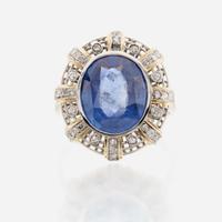 A sapphire, diamond, gold, and platinum ring