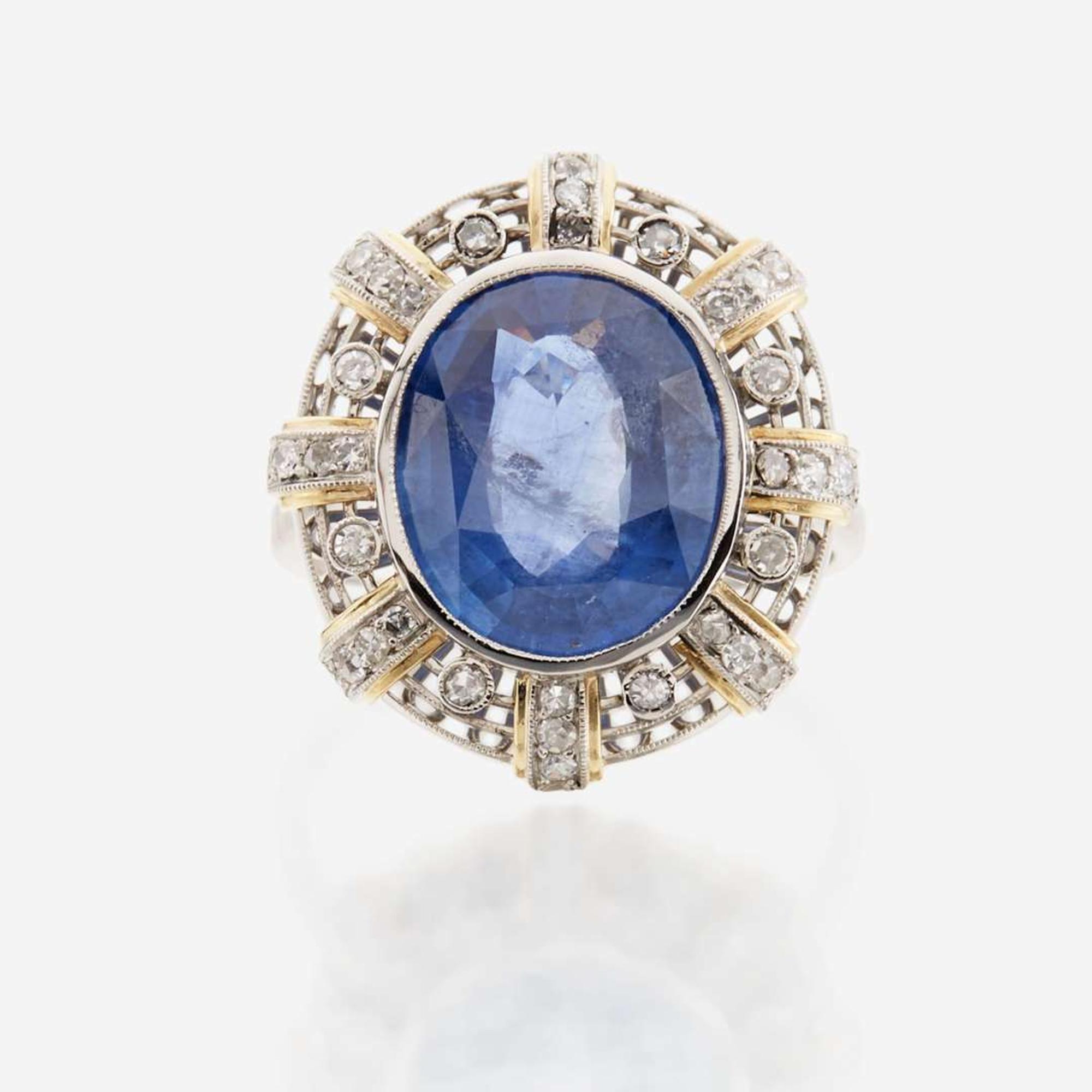 A sapphire, diamond, gold, and platinum ring