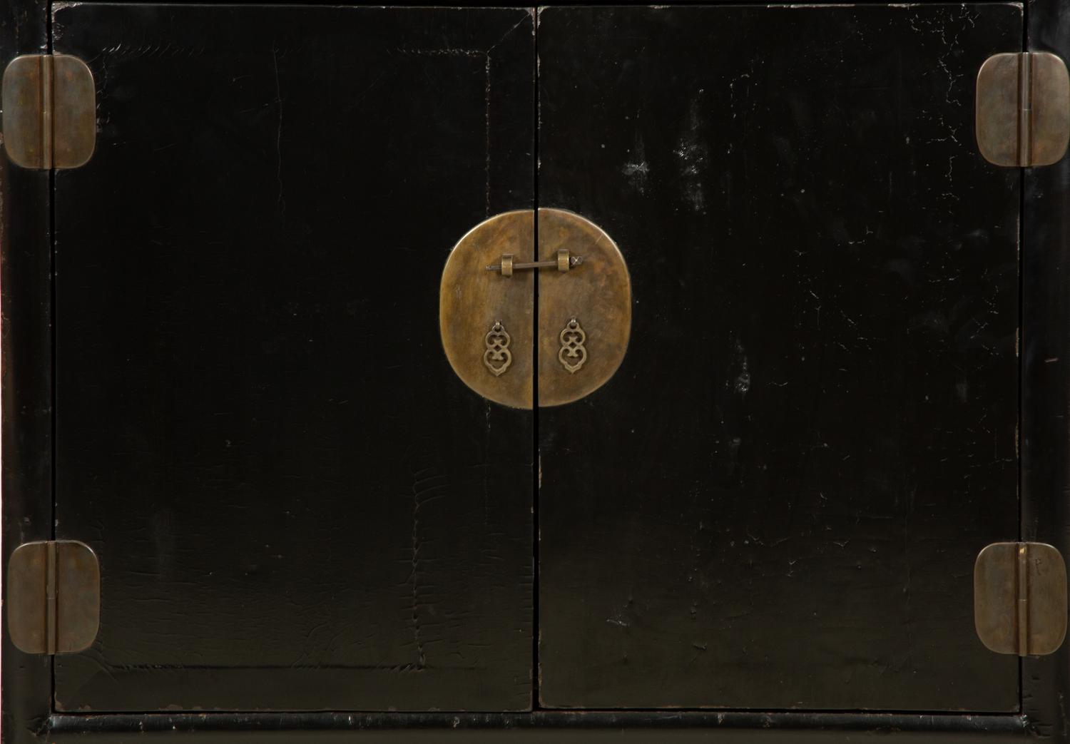 A Chinese Black Lacquer Cabinet with Pierce-carved Upper Door Panels