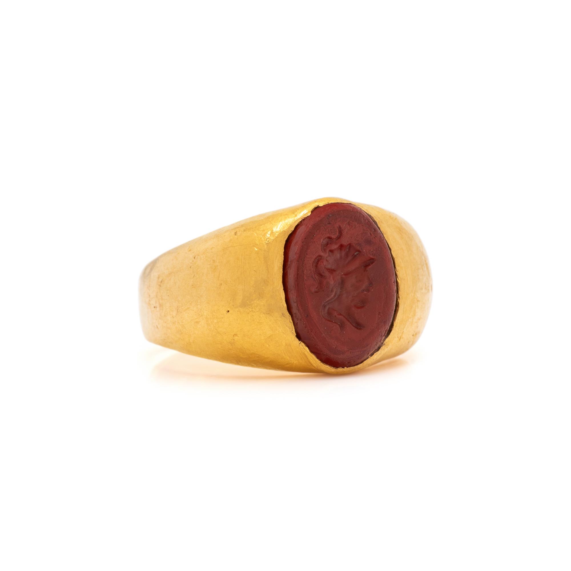 A Roman Gold and Red Jasper Finger Ring with a Male Portrait Head