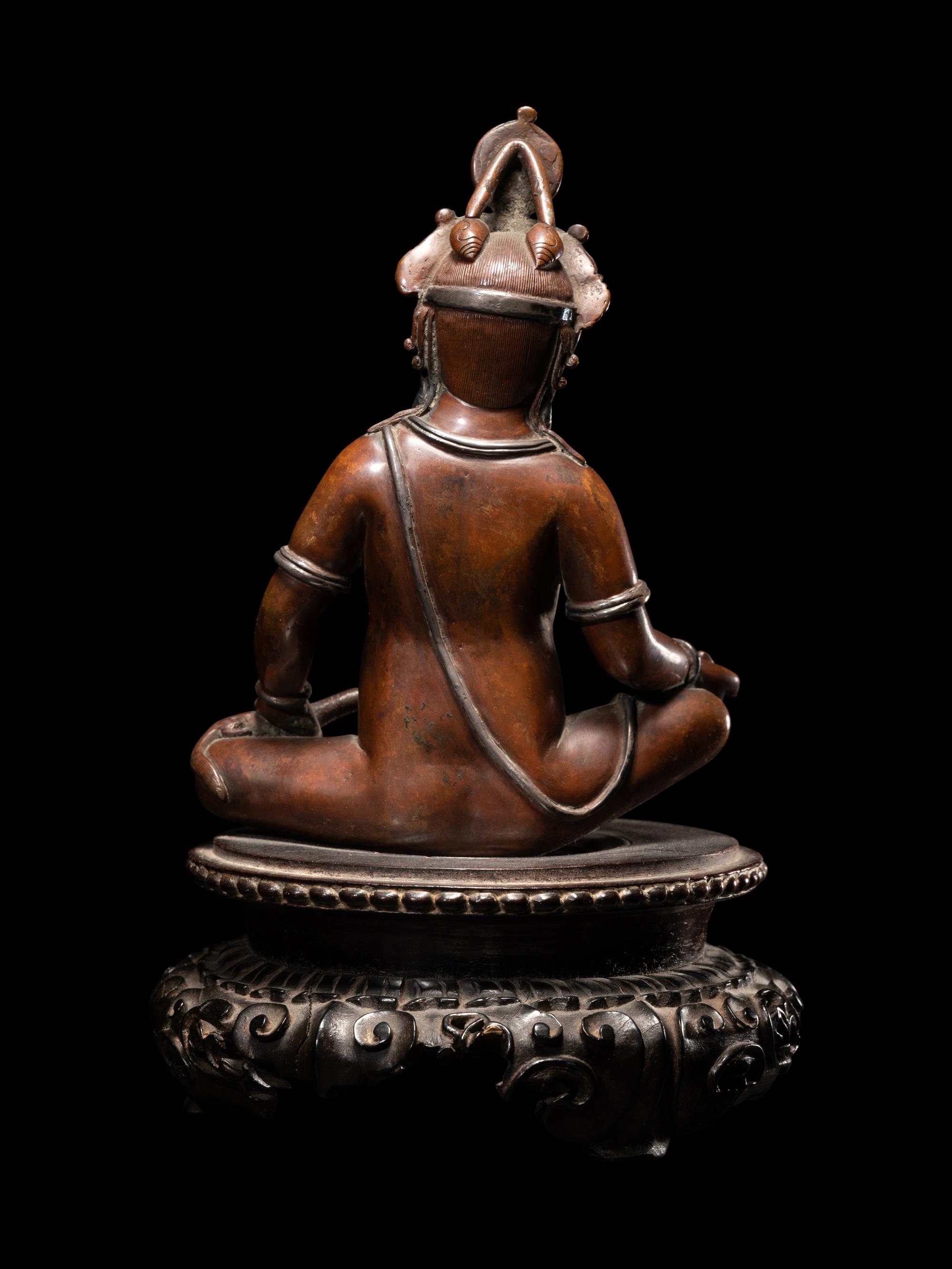 A Nepalese Bronze and Silver Figure of Seated Kubera