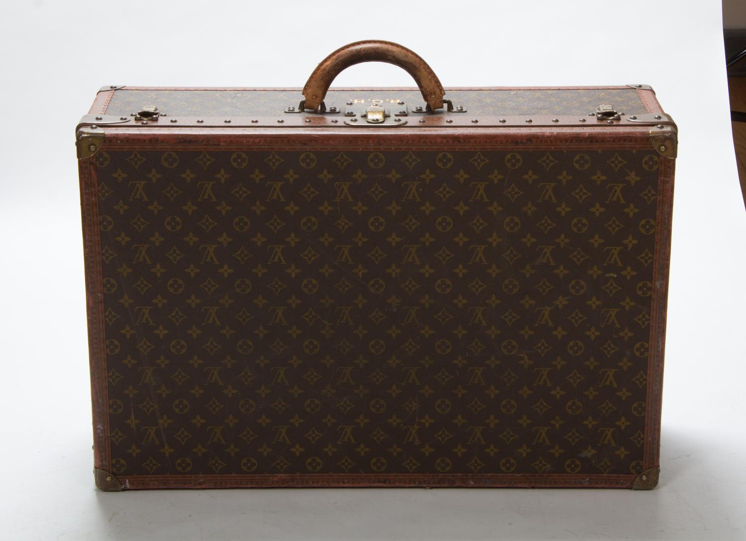 Two Louis Vuitton Monogram Canvas Soft-sided Suitcases, 31 x 20 1/2 x 10 inches.