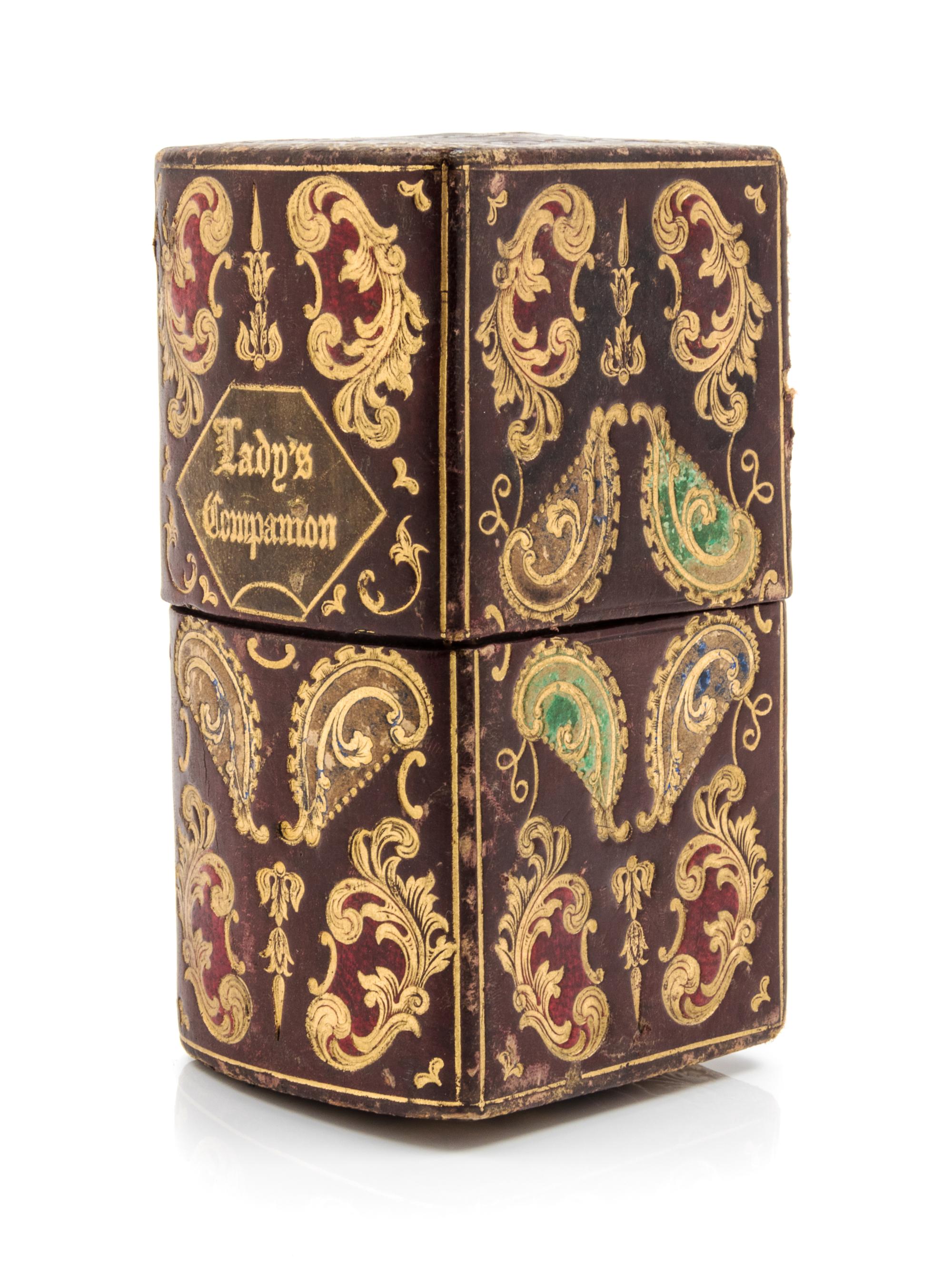 An English Silver and Silver-Plate Necessaire, , the tooled leather case with gilt and polychrome foliate and volute decoration opening