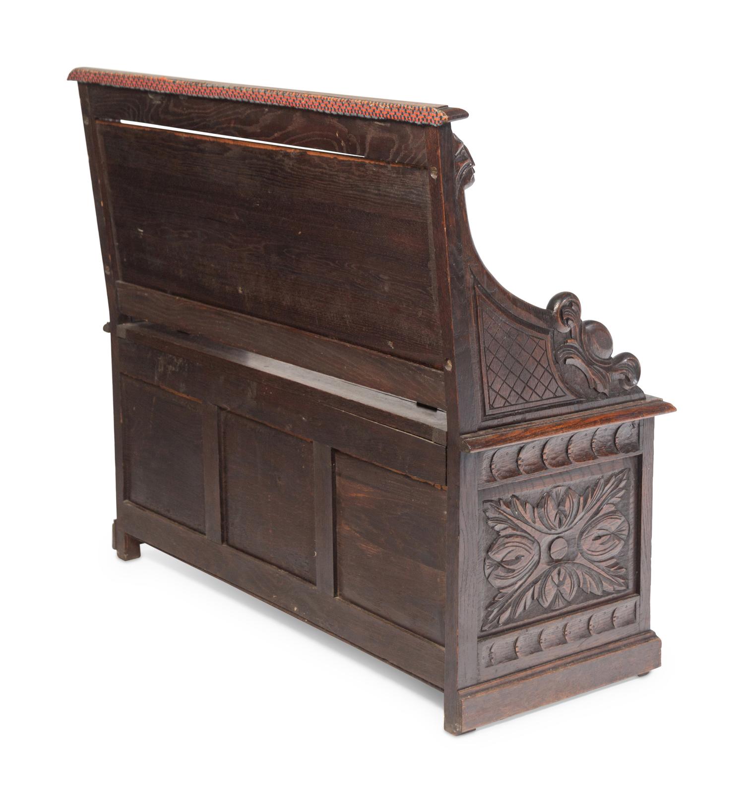 An Italian Renaissance Revival Carved Oak Settle