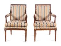 A Pair of Louis XVI Style Walnut Fauteuils