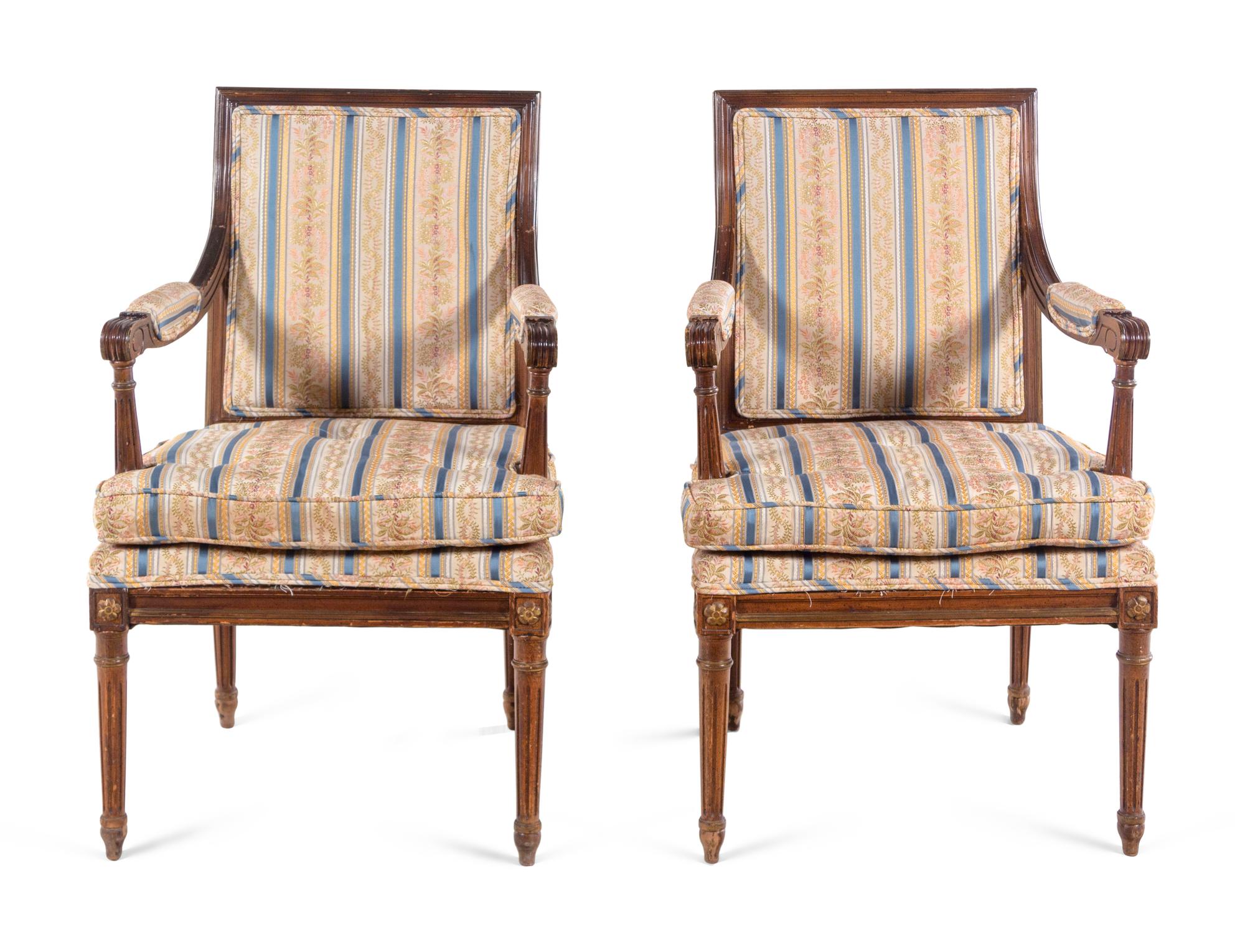 A Pair of Louis XVI Style Walnut Fauteuils