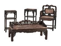 A Chinese Carved Hardwood Four-Piece Furniture Suite