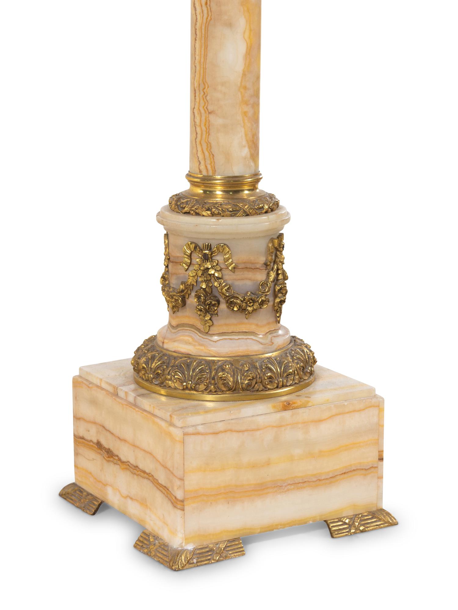 A Pair of French Gilt Bronze Mounted Onyx Pedestals