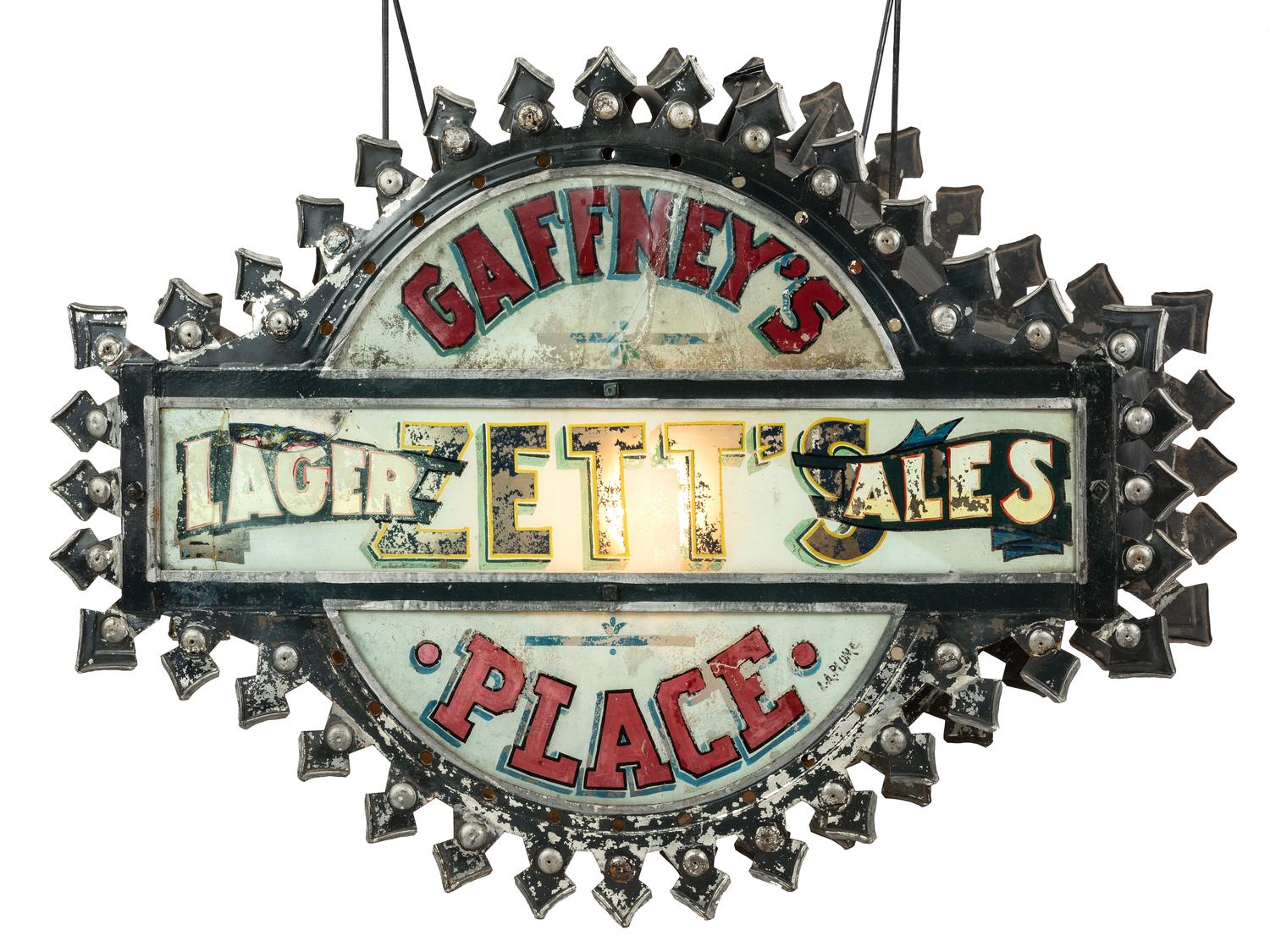 A Zett's Lager and Ales Reverse Painted Glass and Pressed Metal Double-Sided Lighted Bar Sign