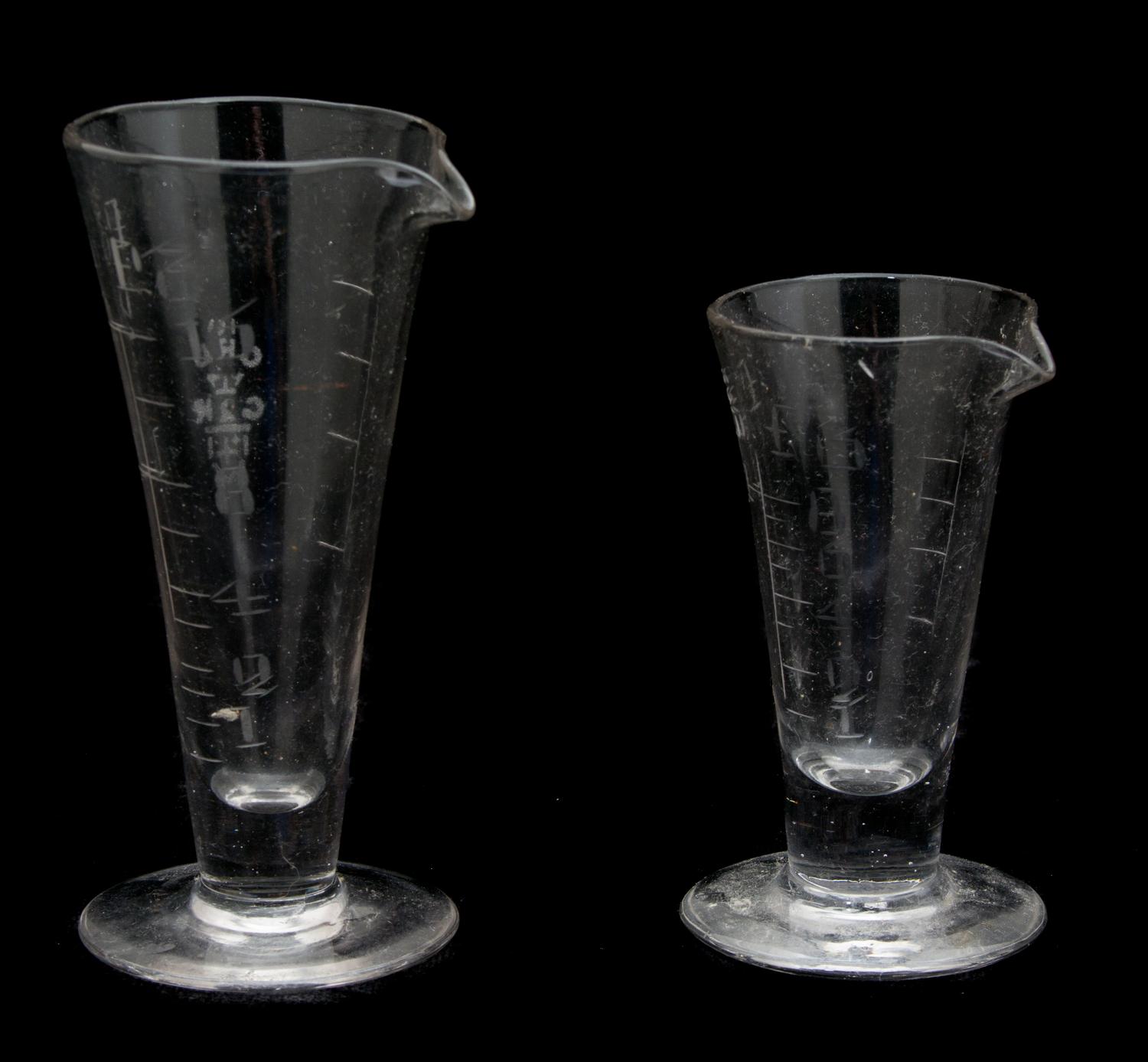 Two Etched Glass Measuring Beakers Height of tallest 5 inches. — 19TH CENTURY