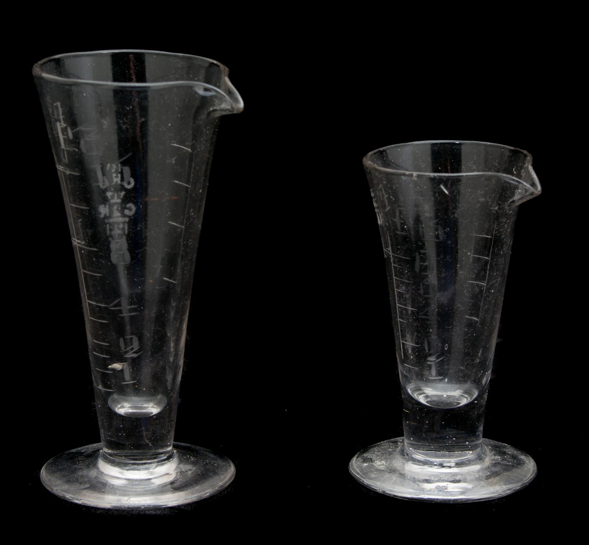 Two Etched Glass Measuring Beakers Height of tallest 5 inches. — 19TH CENTURY