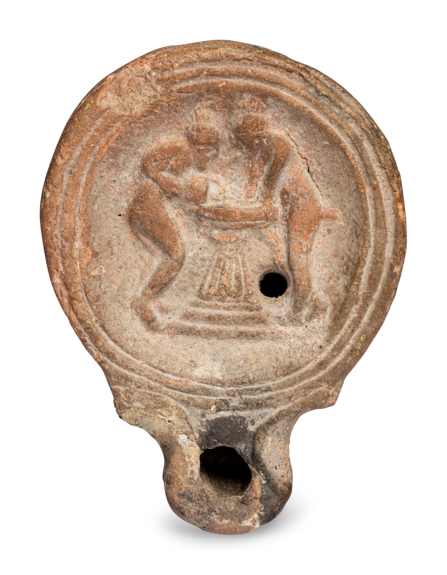 A Roman Terracotta Oil Lamp with Two Women