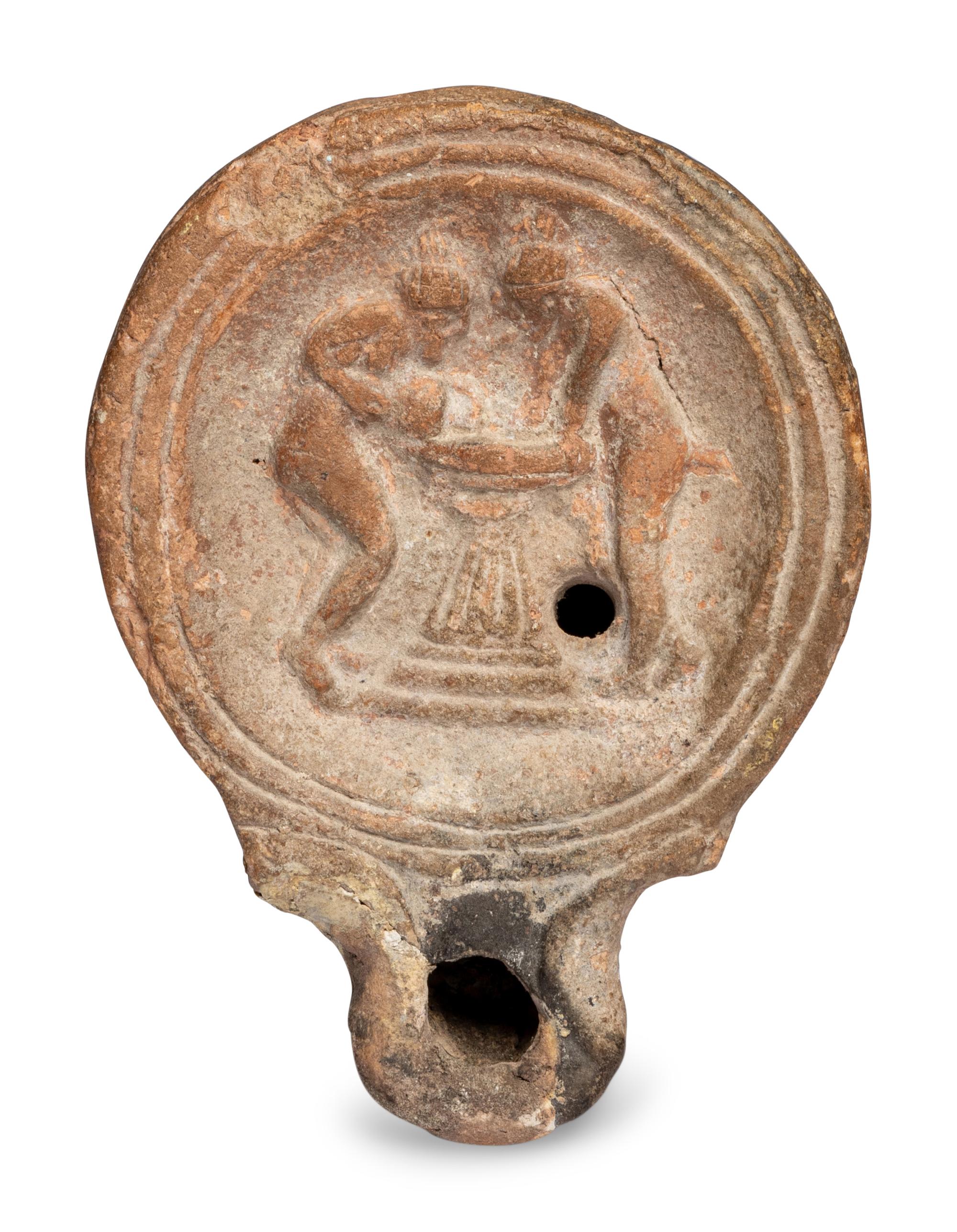 A Roman Terracotta Oil Lamp with Two Women