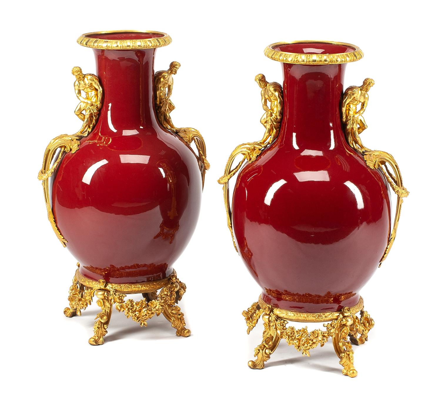 A Pair of French Gilt Bronze Mounted Sang de Boeuf Vases Height 30 inches.