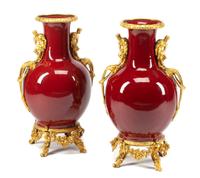 A Pair of French Gilt Bronze Mounted Sang de Boeuf Vases Height 30 inches.