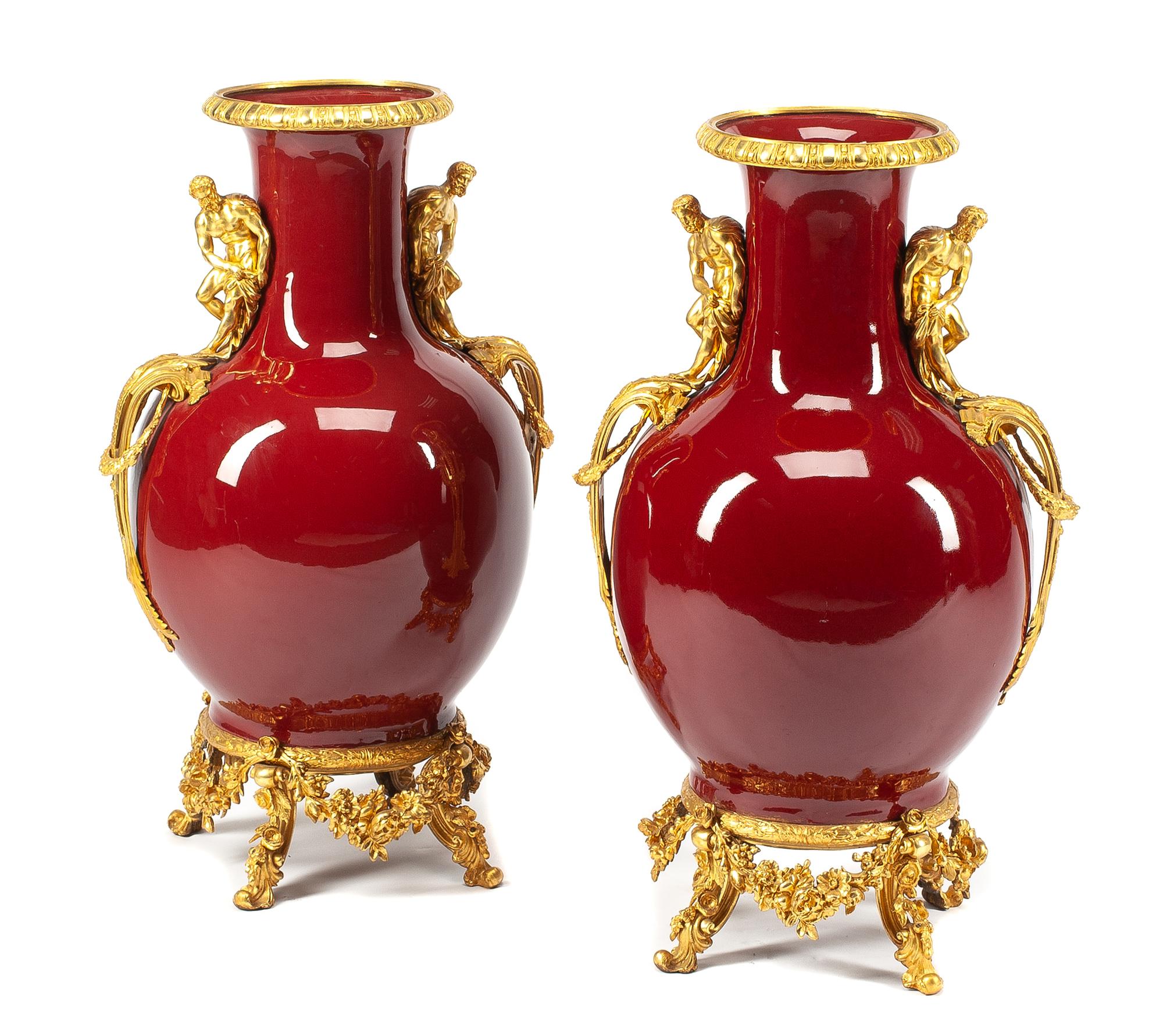 A Pair of French Gilt Bronze Mounted Sang de Boeuf Vases Height 30 inches.
