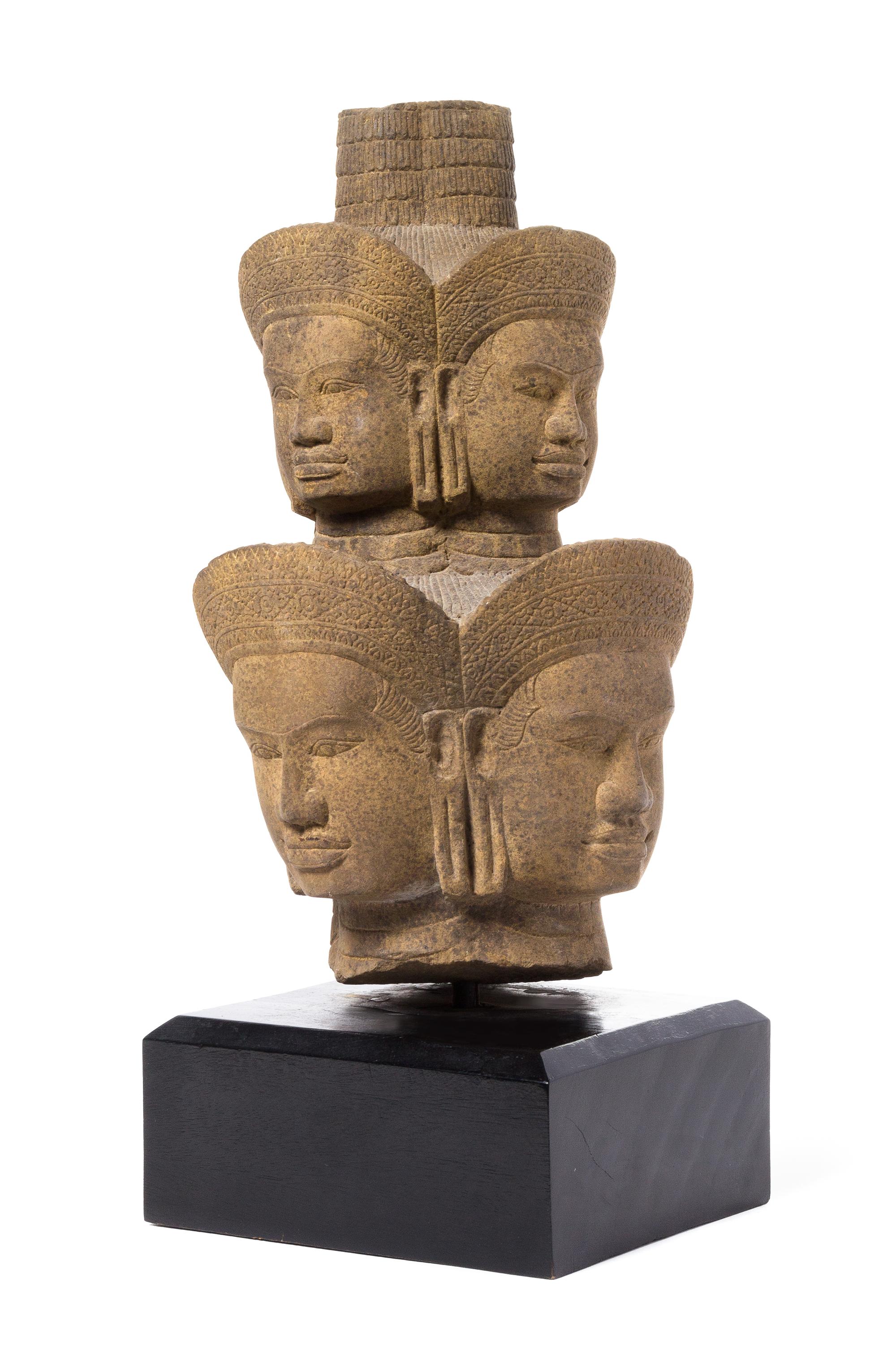 A Khmer Sandstone Head of Brahma — 14TH CENTURY