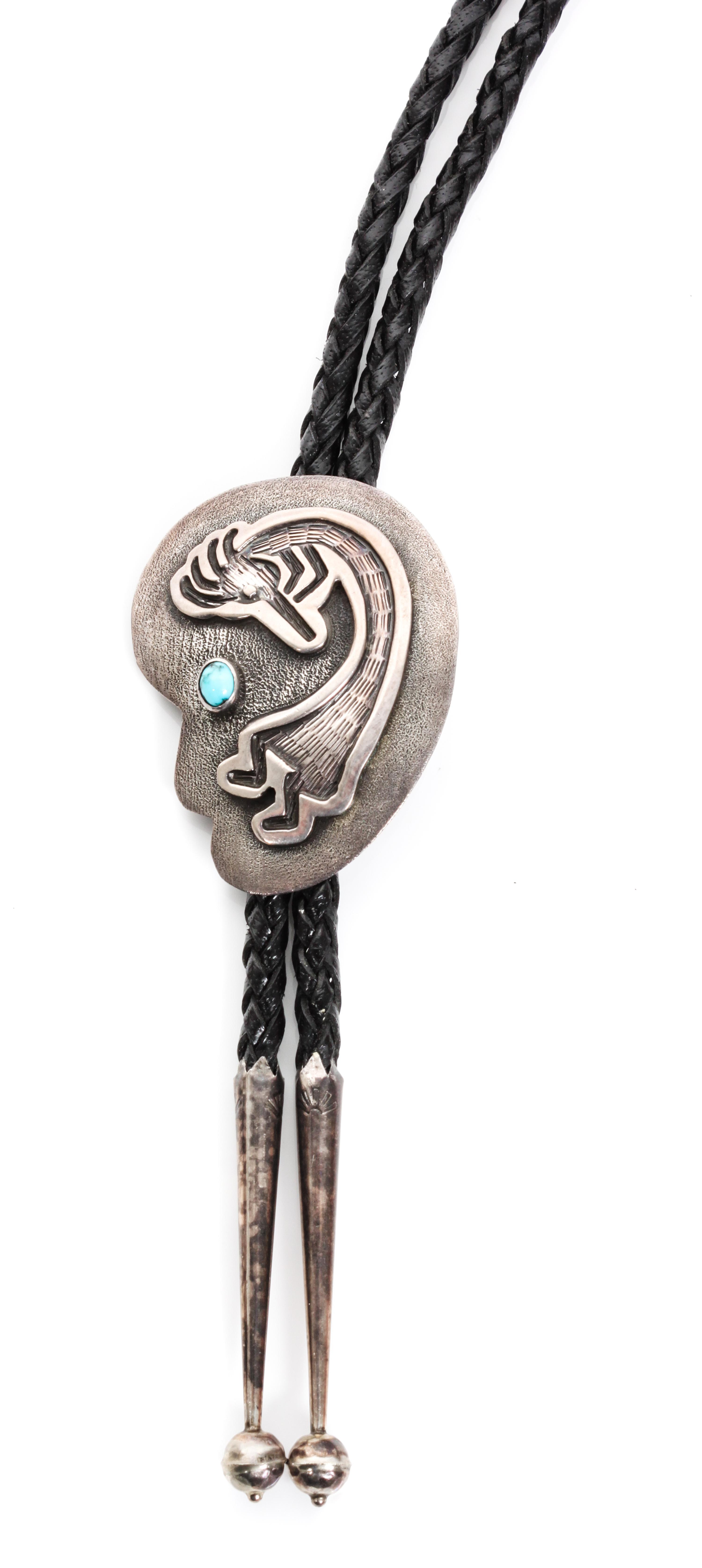 A Navajo Silver and Turquoise Bolo, P. Yellowhorse Height 2 1/4 x width 1 3/4 inches.