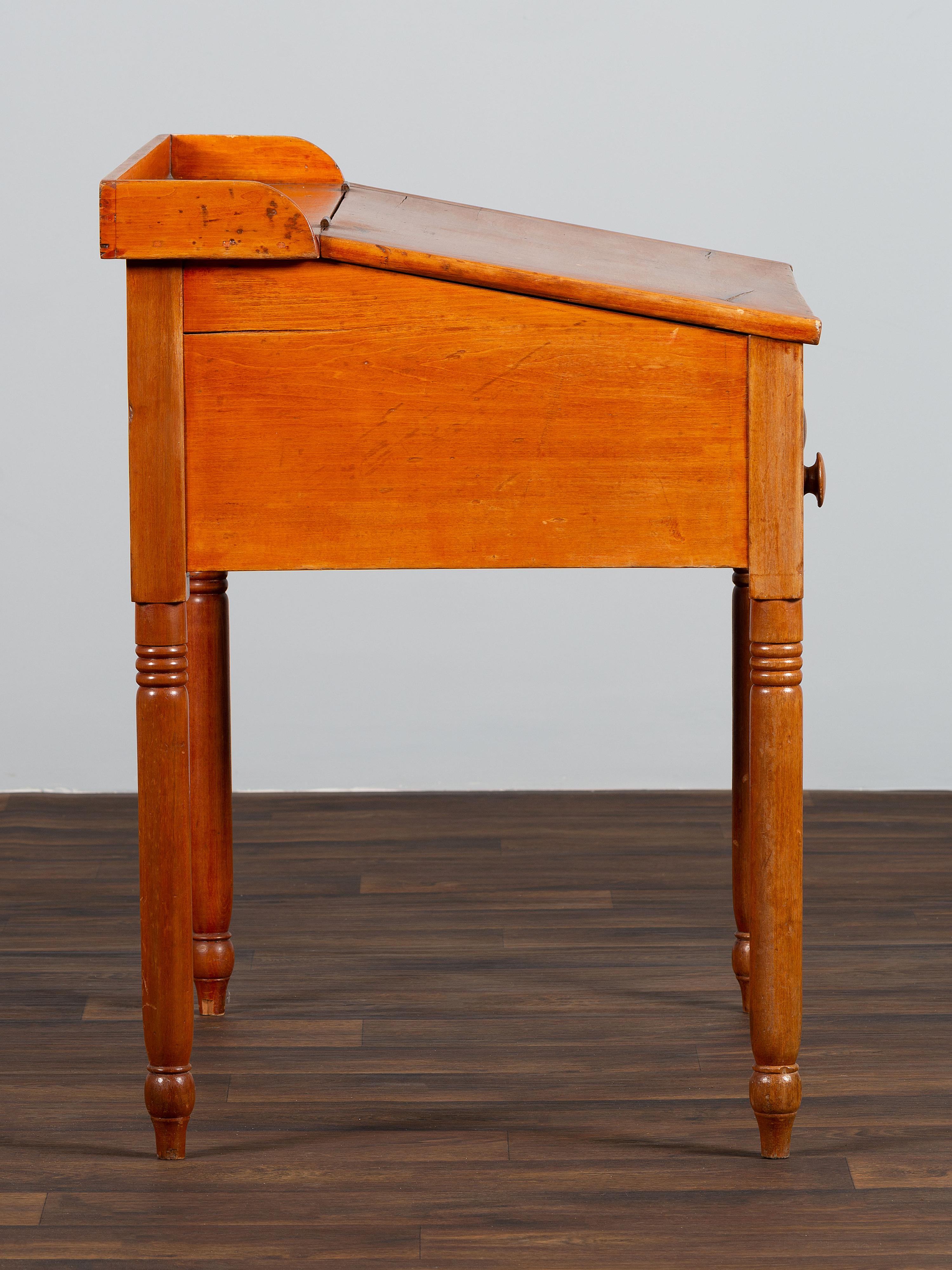 A Late Federal Red-Stained Pine One-Drawer Slant-Lid Schoolmaster's Desk