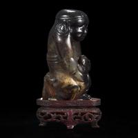 An unusual Chinese dark brown-black jade carving of a Lohan 笑狮罗汉玉雕 Ming dynasty or earlier ????