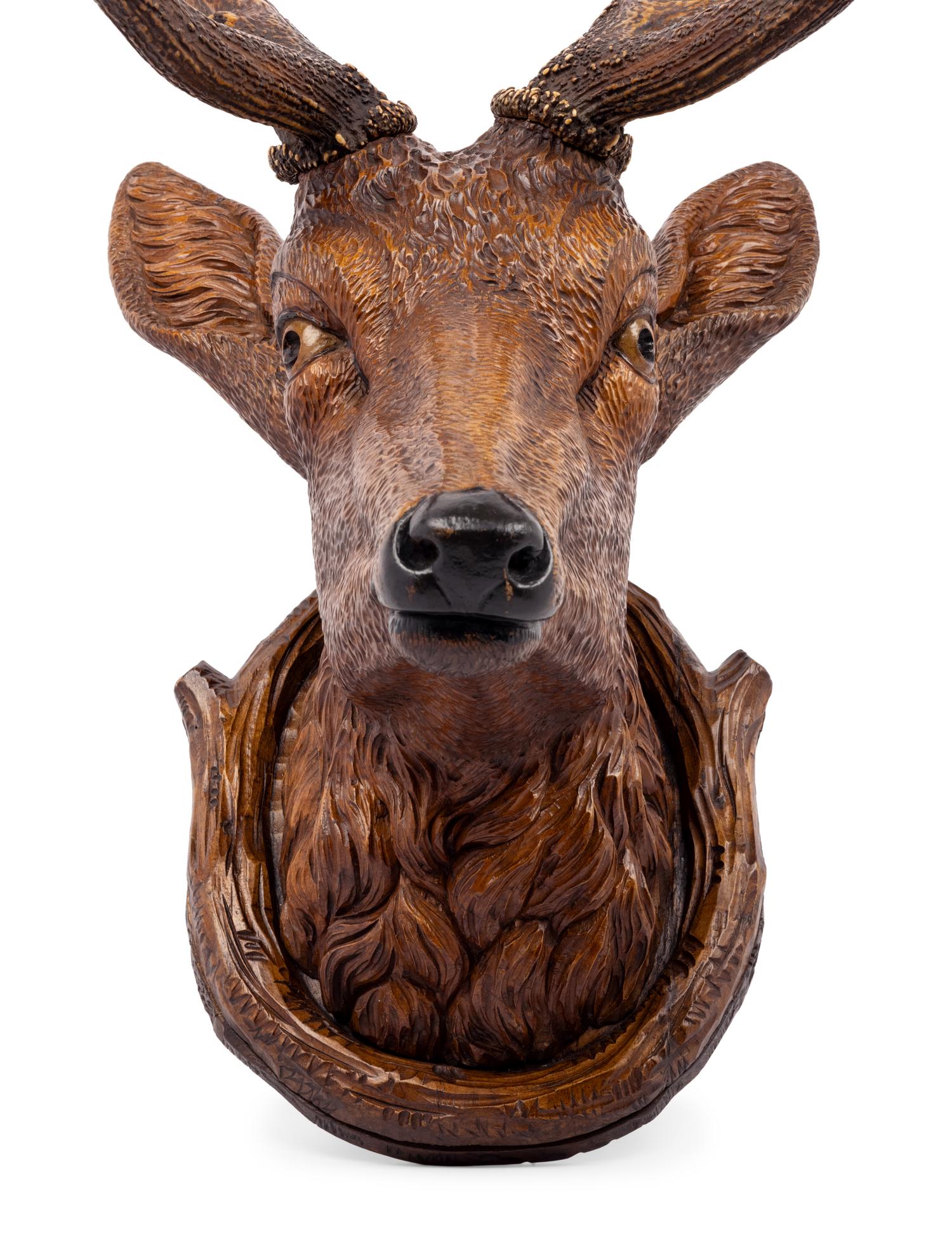 A Black Forest Carved Stag Head