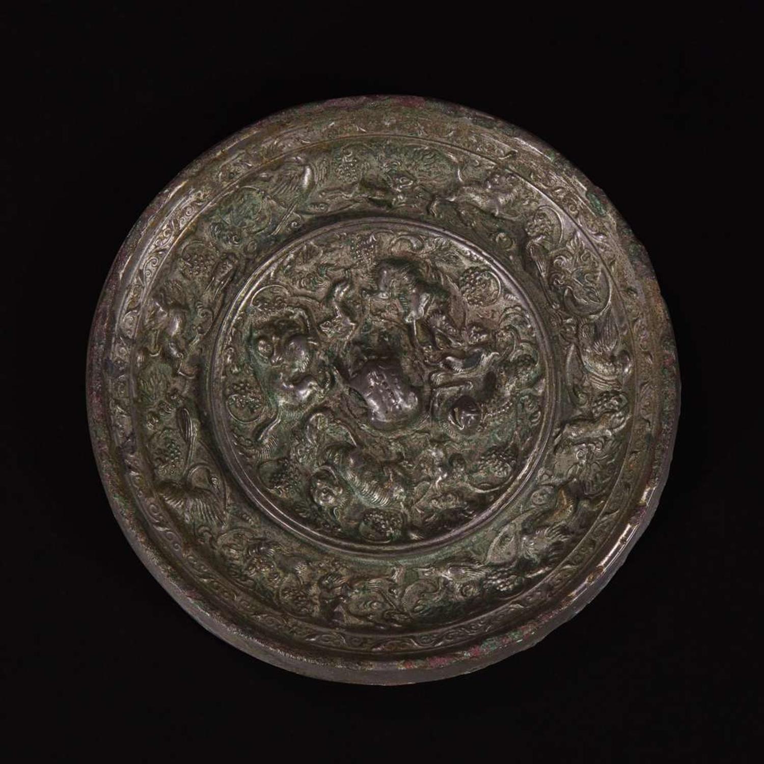 An unusual Chinese "Beast and Grapes" bronze mirror 海兽葡萄纹铜镜 Tang dynasty ?