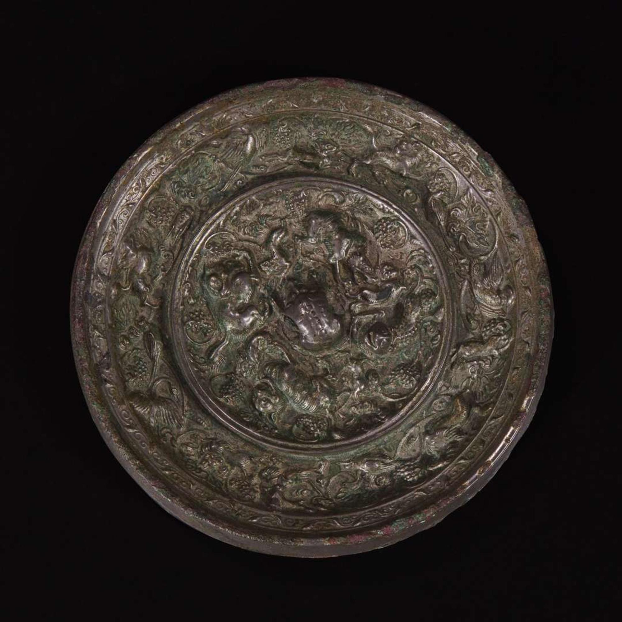 An unusual Chinese "Beast and Grapes" bronze mirror 海兽葡萄纹铜镜 Tang dynasty ?