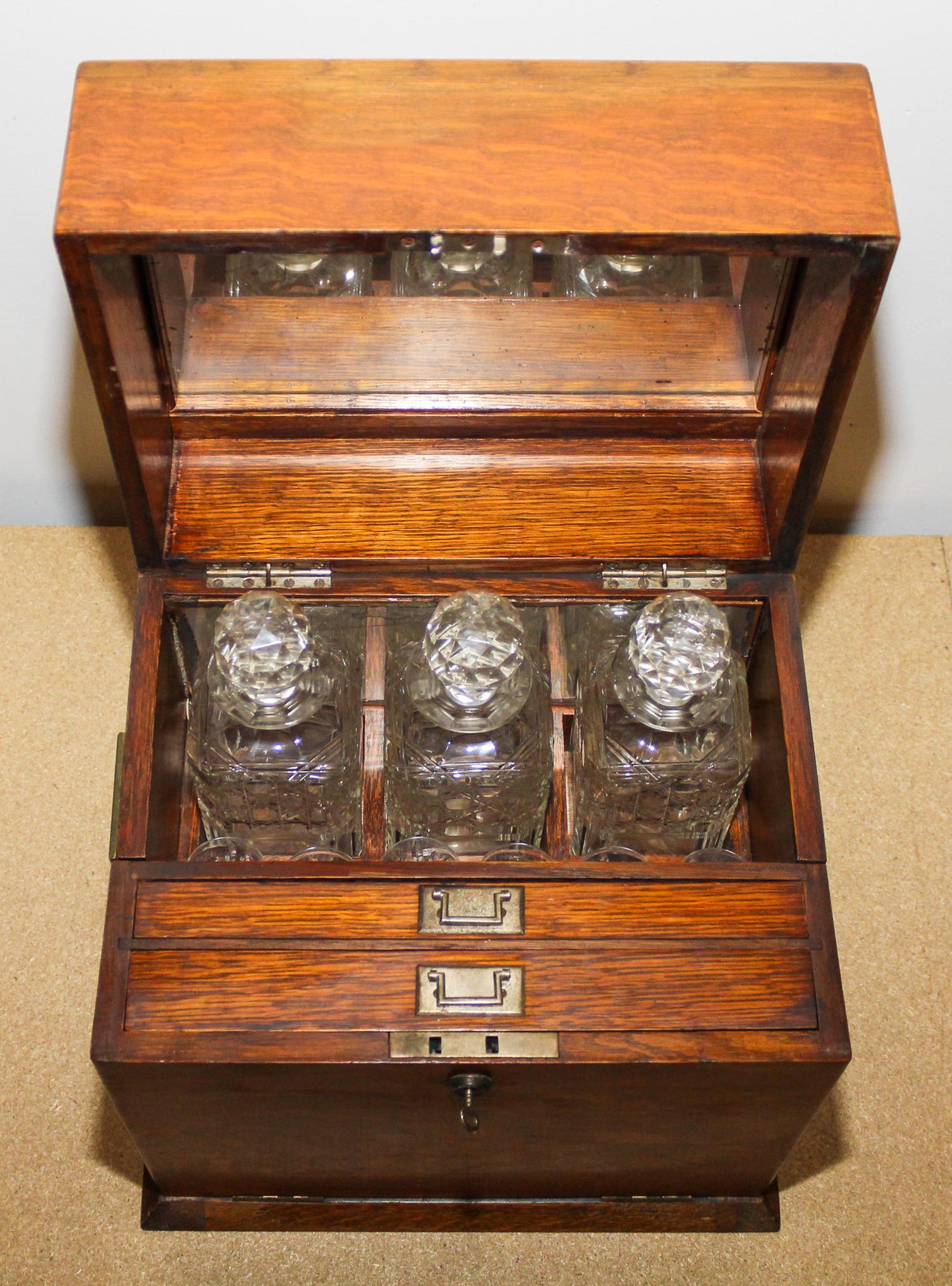 An American Oak Decanter Case Height 14 1/8 x width 13 1/4 x depth 10 inches.