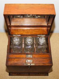 An American Oak Decanter Case Height 14 1/8 x width 13 1/4 x depth 10 inches.