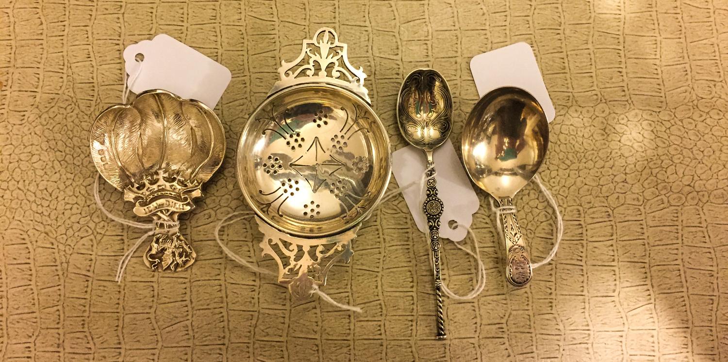 A Group of Four Victorian Silver Tea Articles, Various makers, comprising a tea strainer, two tea scoops and a teaspoon.