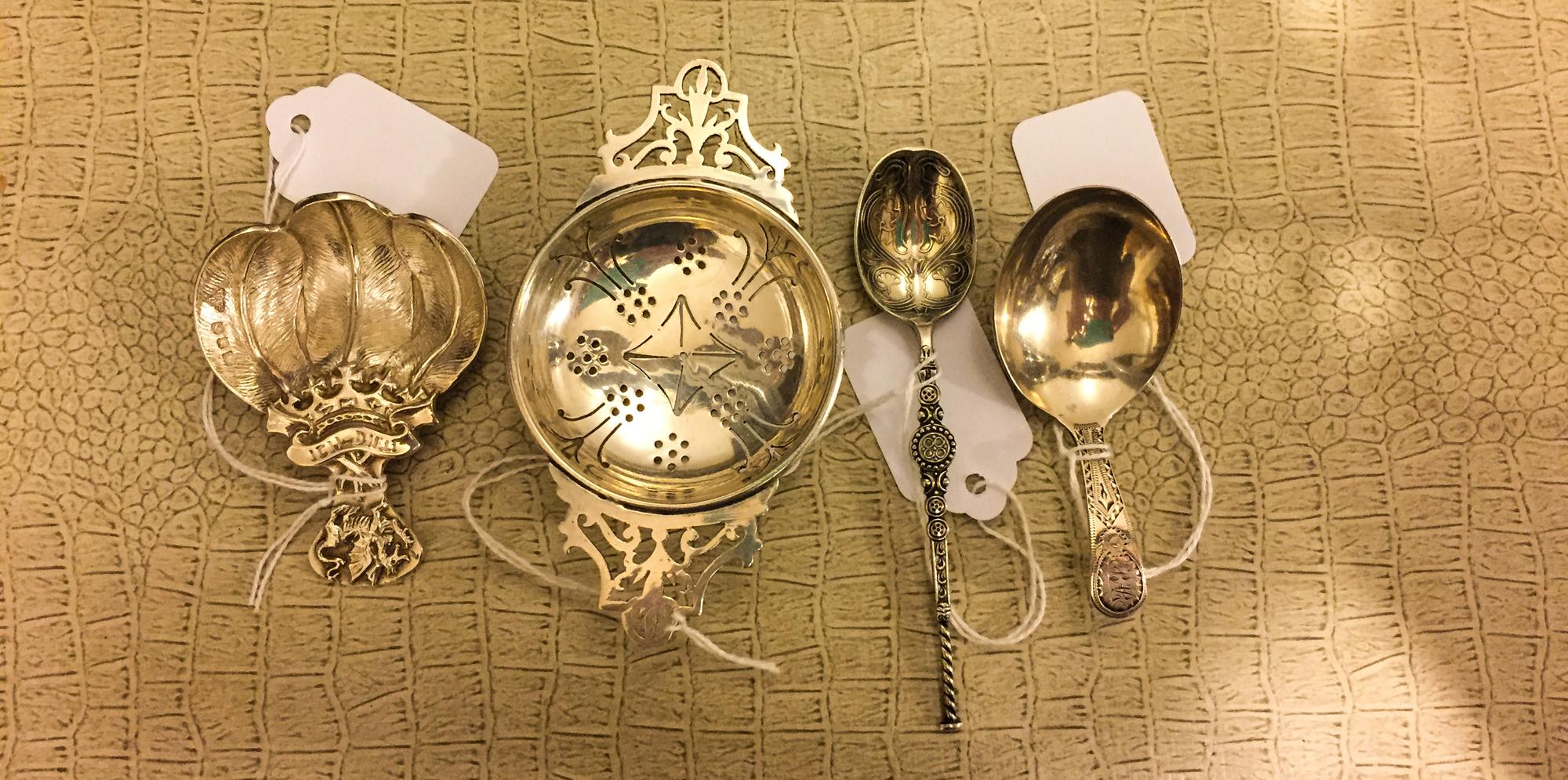 A Group of Four Victorian Silver Tea Articles, Various makers, comprising a tea strainer, two tea scoops and a teaspoon.