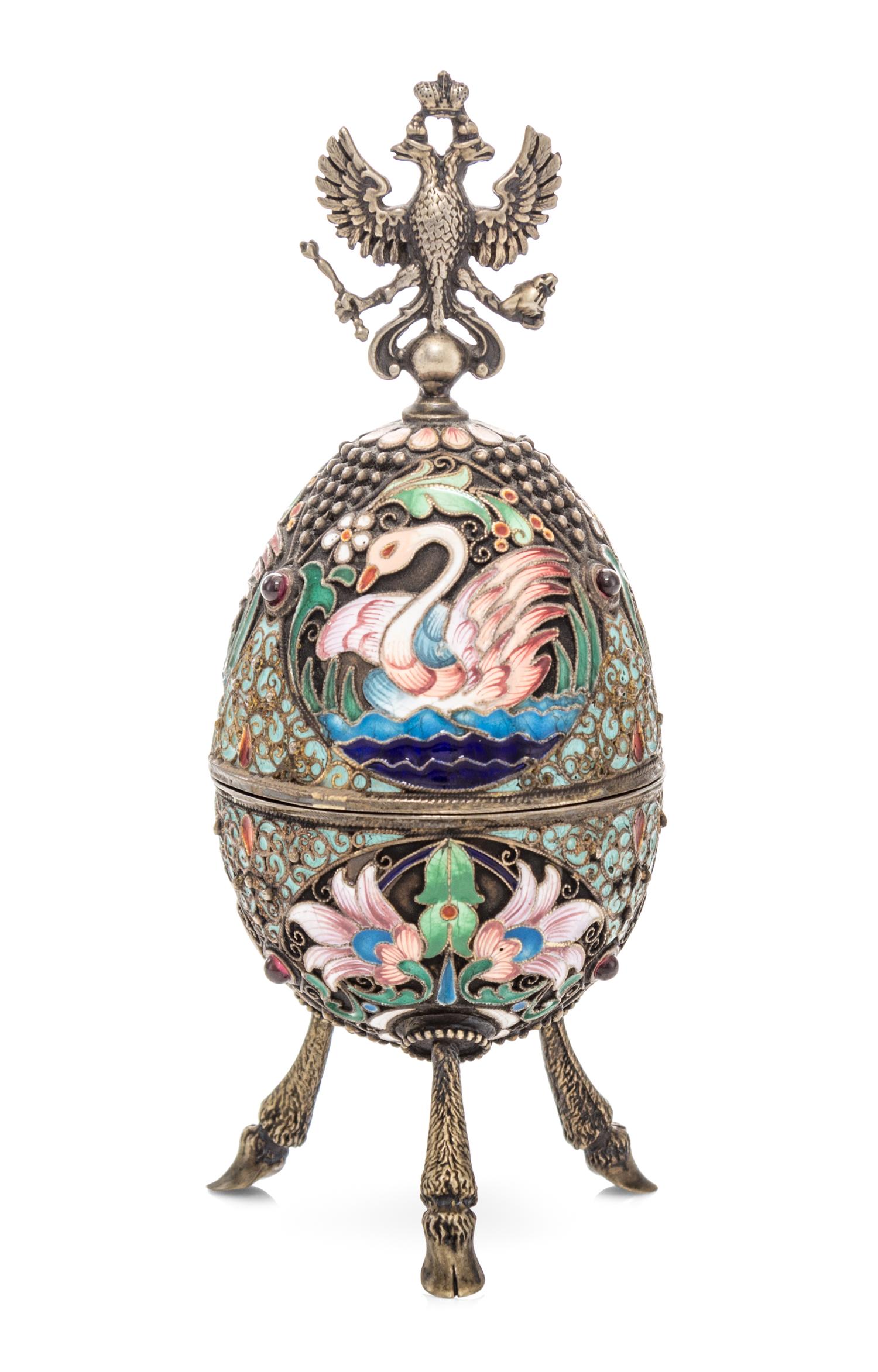A Russian Silver and Enameled Egg, Dmitrii Aleksandrov Pastukhov, Moscow, 1908-1926, having a double-headed eagle crest over the swan d