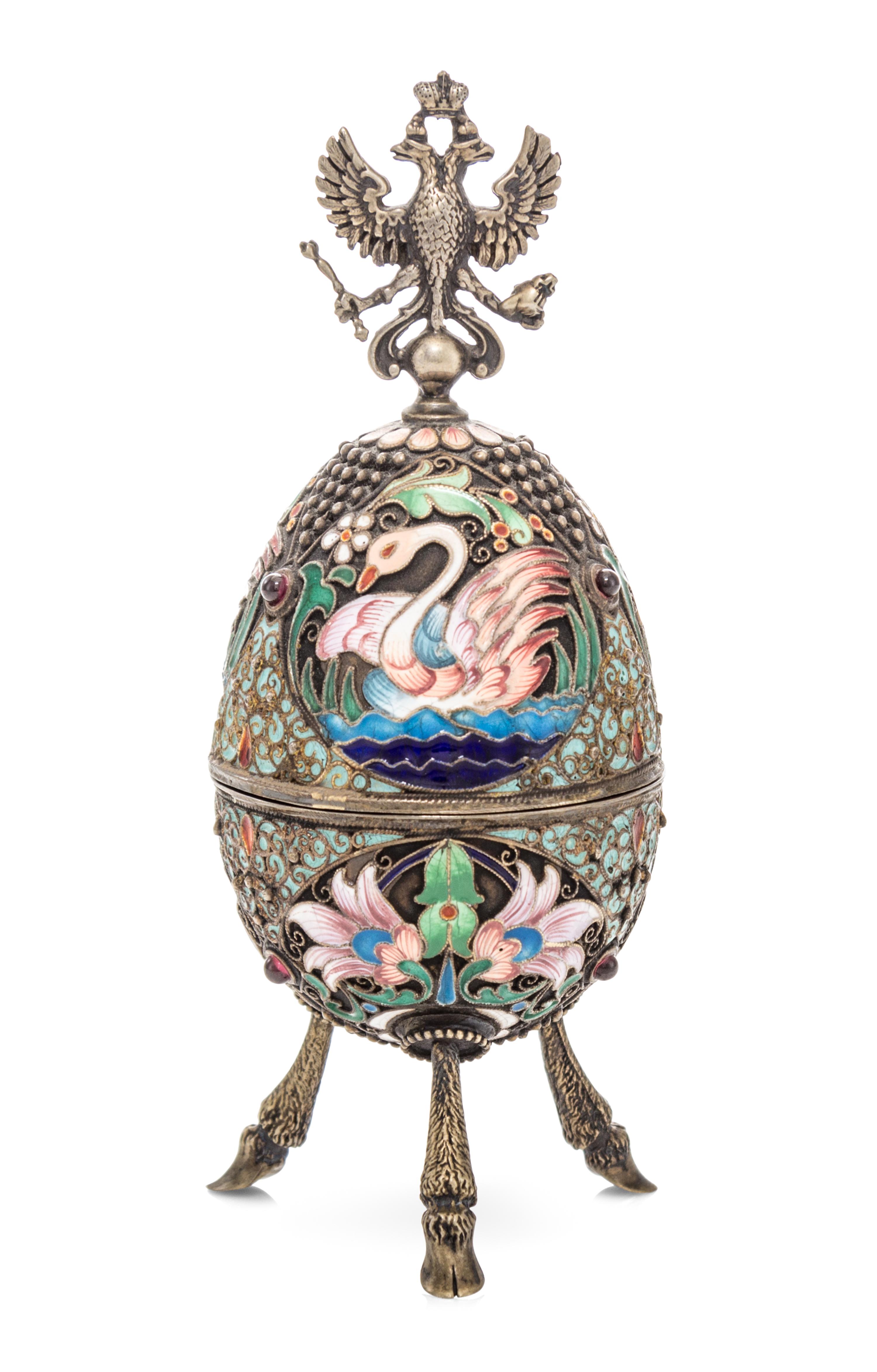 A Russian Silver and Enameled Egg, Dmitrii Aleksandrov Pastukhov, Moscow, 1908-1926, having a double-headed eagle crest over the swan d