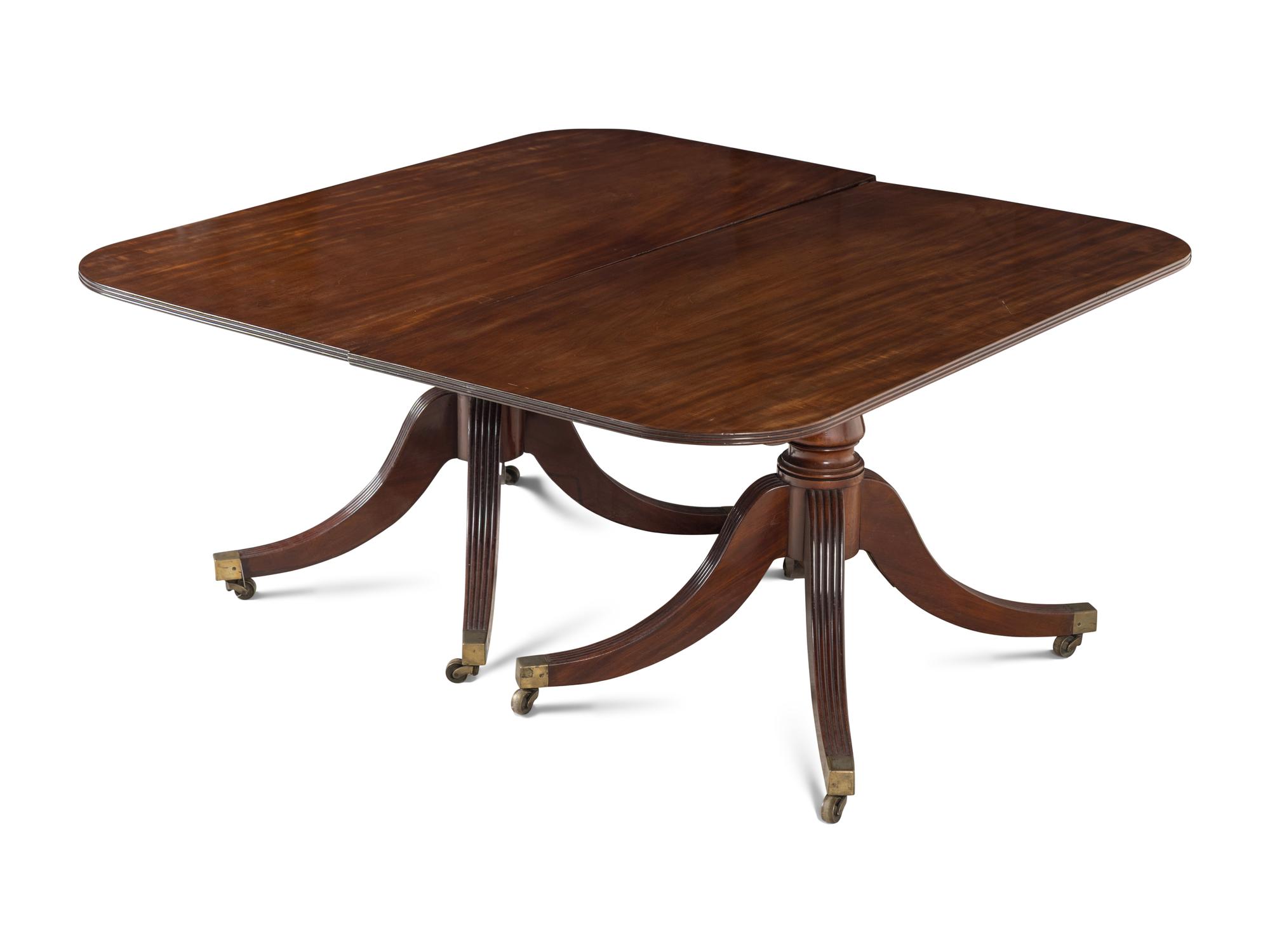 A Regency Mahogany Triple Pedestal Dining Table