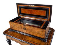 A Swiss Parcel Ebonized and Mother-of-Pearl Inlaid Burlwood Music Box on Stand