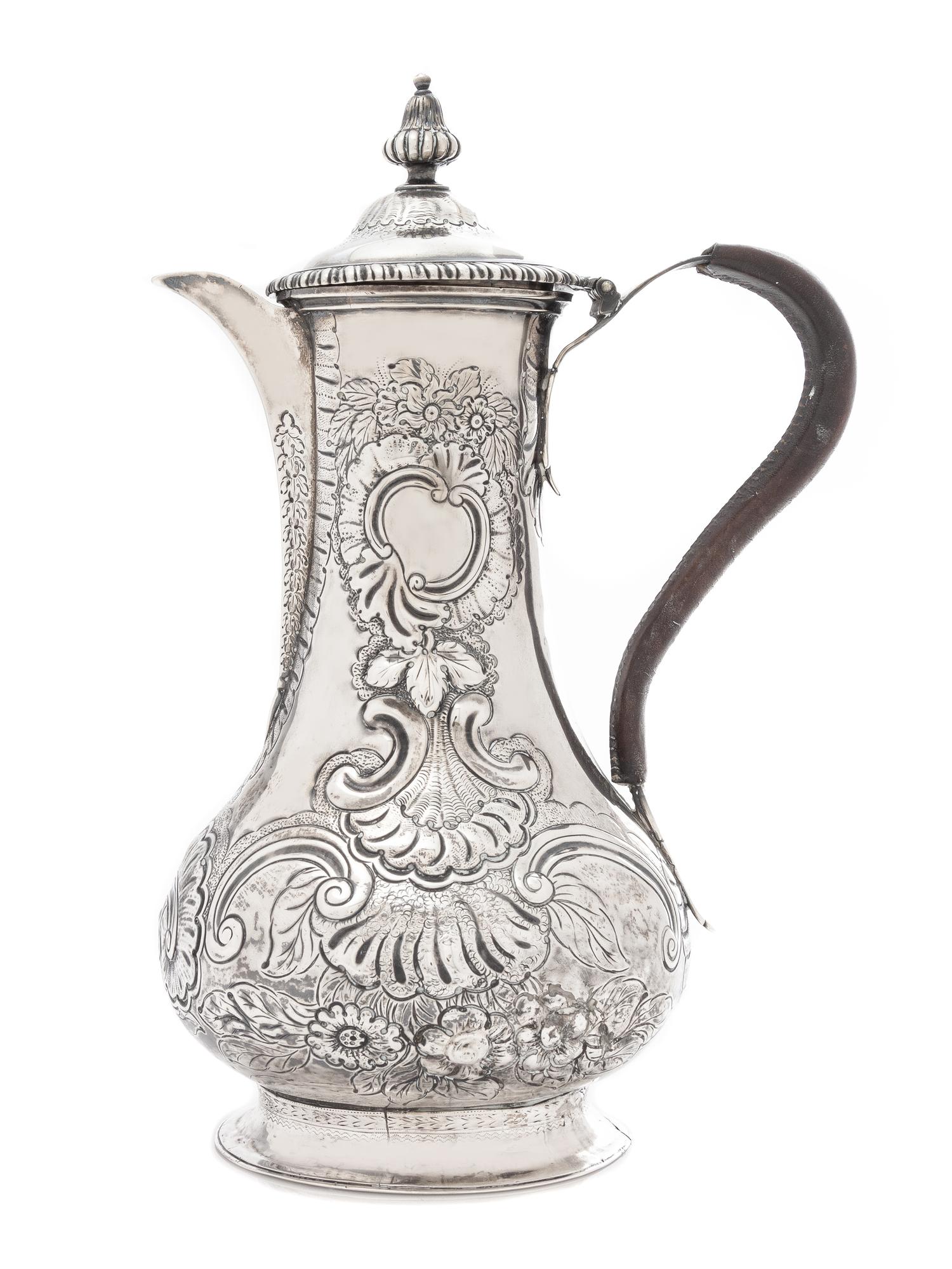 A George III Silver Coffee Pot, Louis Herne & Fras. Butty, London, 1762, the reeded finial above the domed lid with a gadroon rim, the
