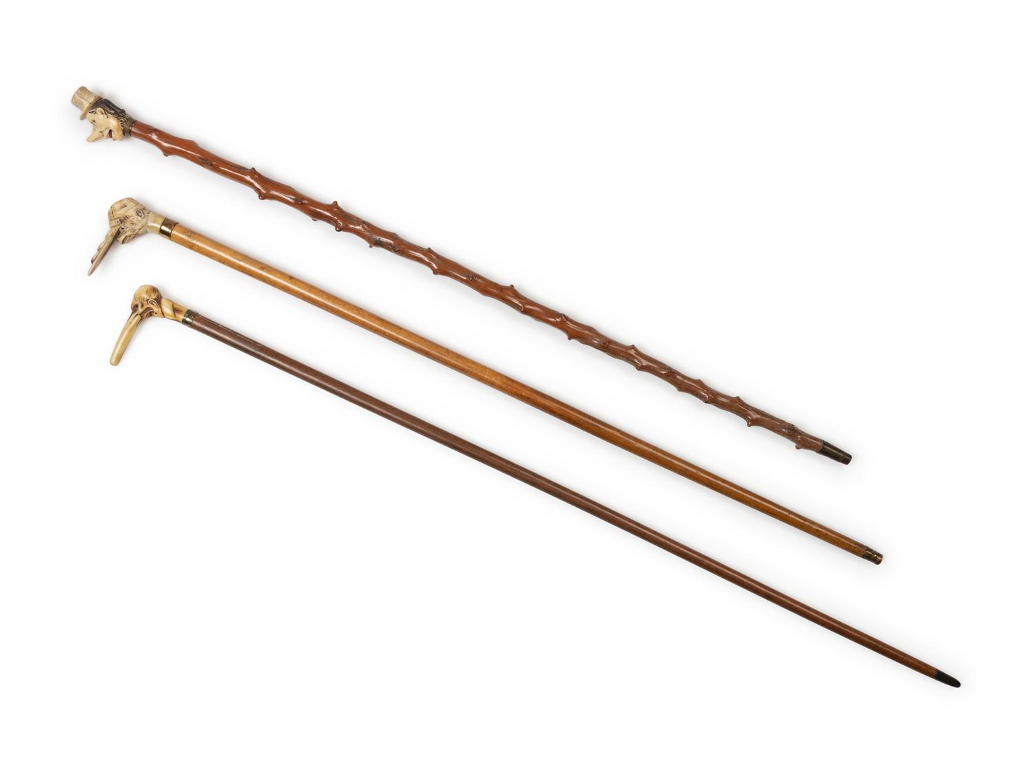 Three Carved Horn or Bone and Brass-Mounted Figural Canes