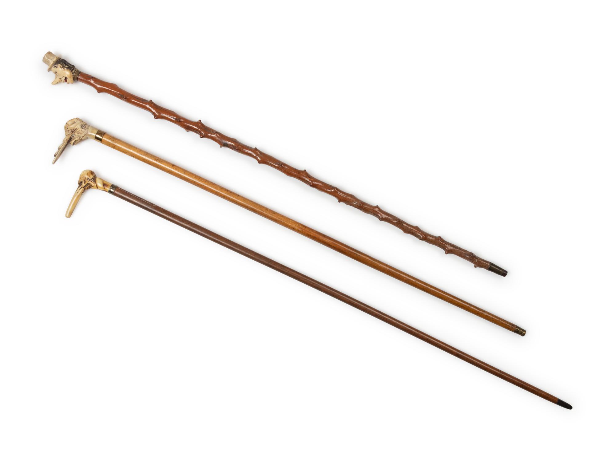 Three Carved Horn or Bone and Brass-Mounted Figural Canes