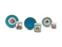 Three Sèvres Painted, Parcel Gilt and "Jeweled" Celeste Blue-Ground Porcelain Teacups and Saucers