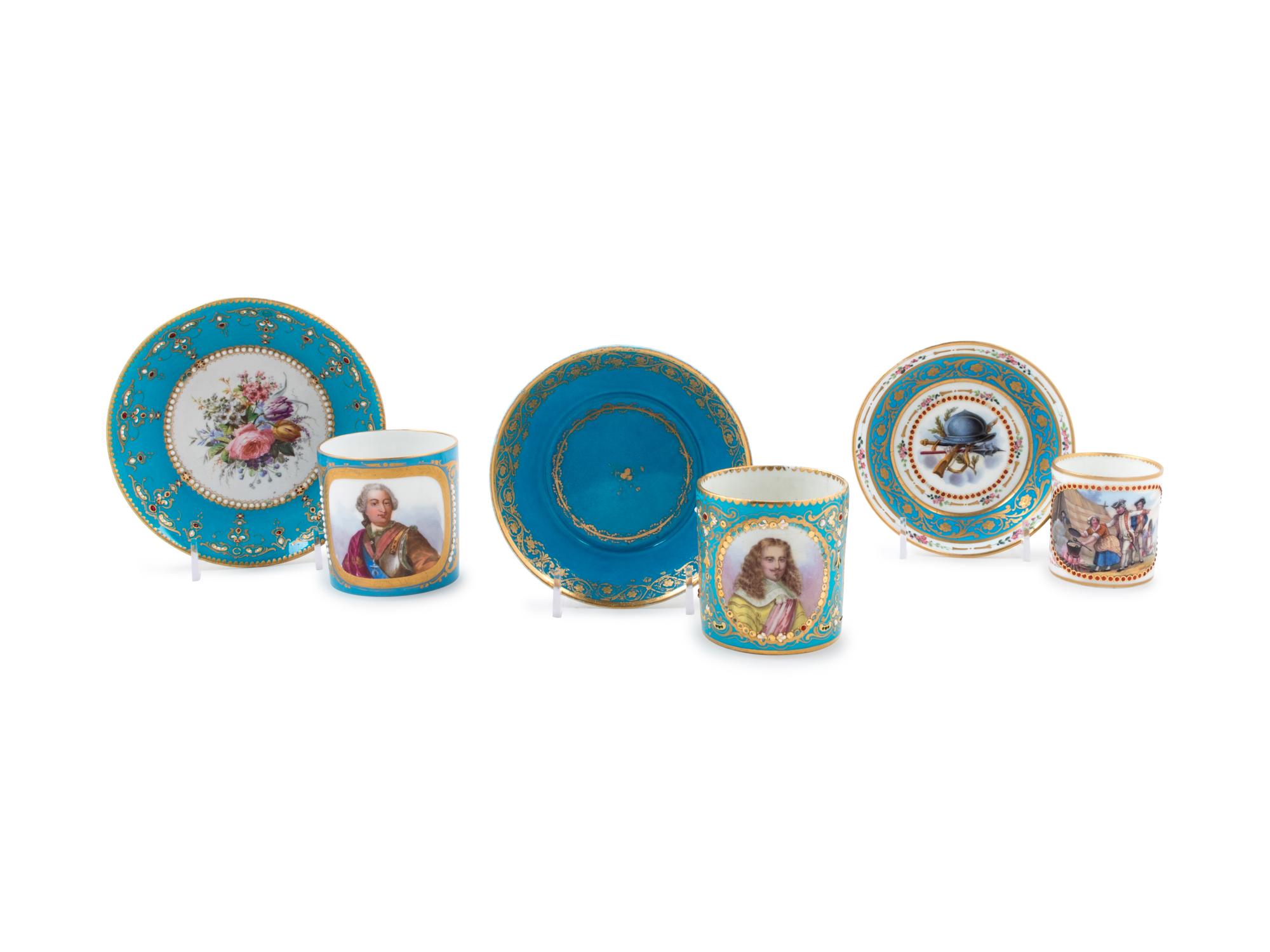 Three Sèvres Painted, Parcel Gilt and "Jeweled" Celeste Blue-Ground Porcelain Teacups and Saucers