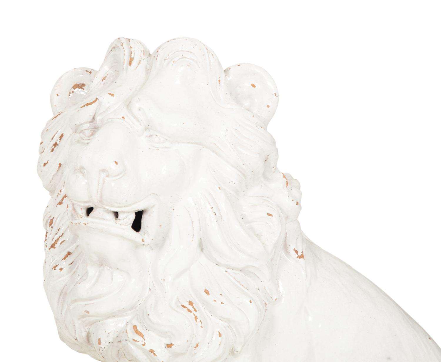 A Pair of Italian White Glazed Ceramic Seated Lions