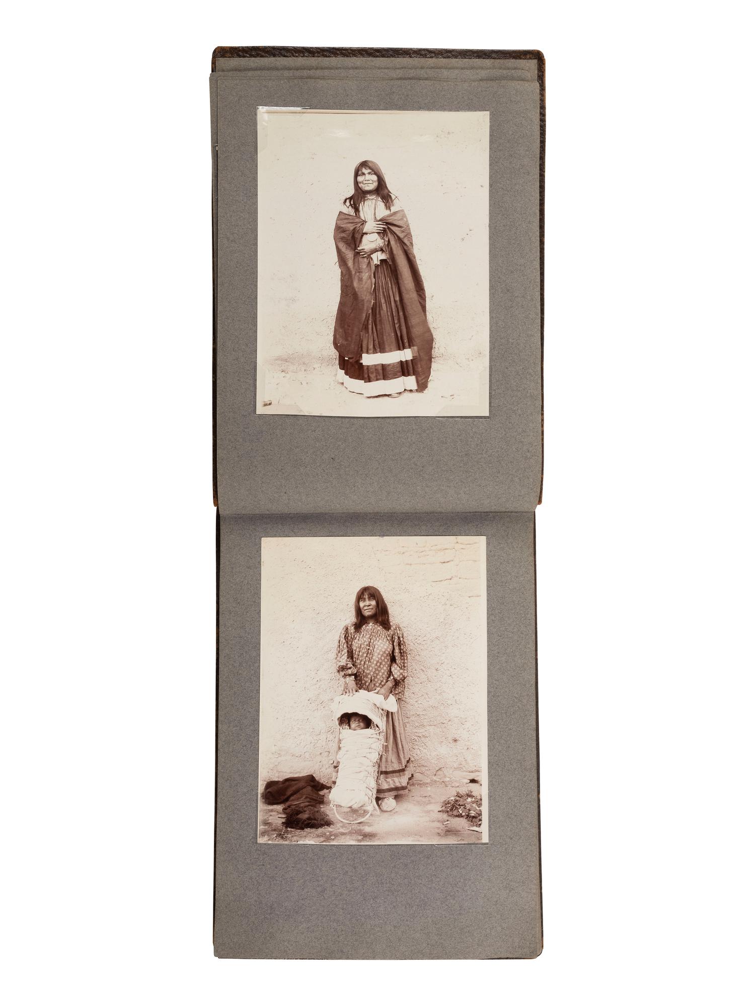 [NATIVE AMERICANS]. JONES, John Edward (1863-1922), photographer. Album containing 50 photographs of the San Carlos Indian Agency, including Apache civilians and police, agency buildings and dwellings, and scenic views. Ca 1904.