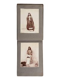 [NATIVE AMERICANS]. JONES, John Edward (1863-1922), photographer. Album containing 50 photographs of the San Carlos Indian Agency, including Apache civilians and police, agency buildings and dwellings, and scenic views. Ca 1904.