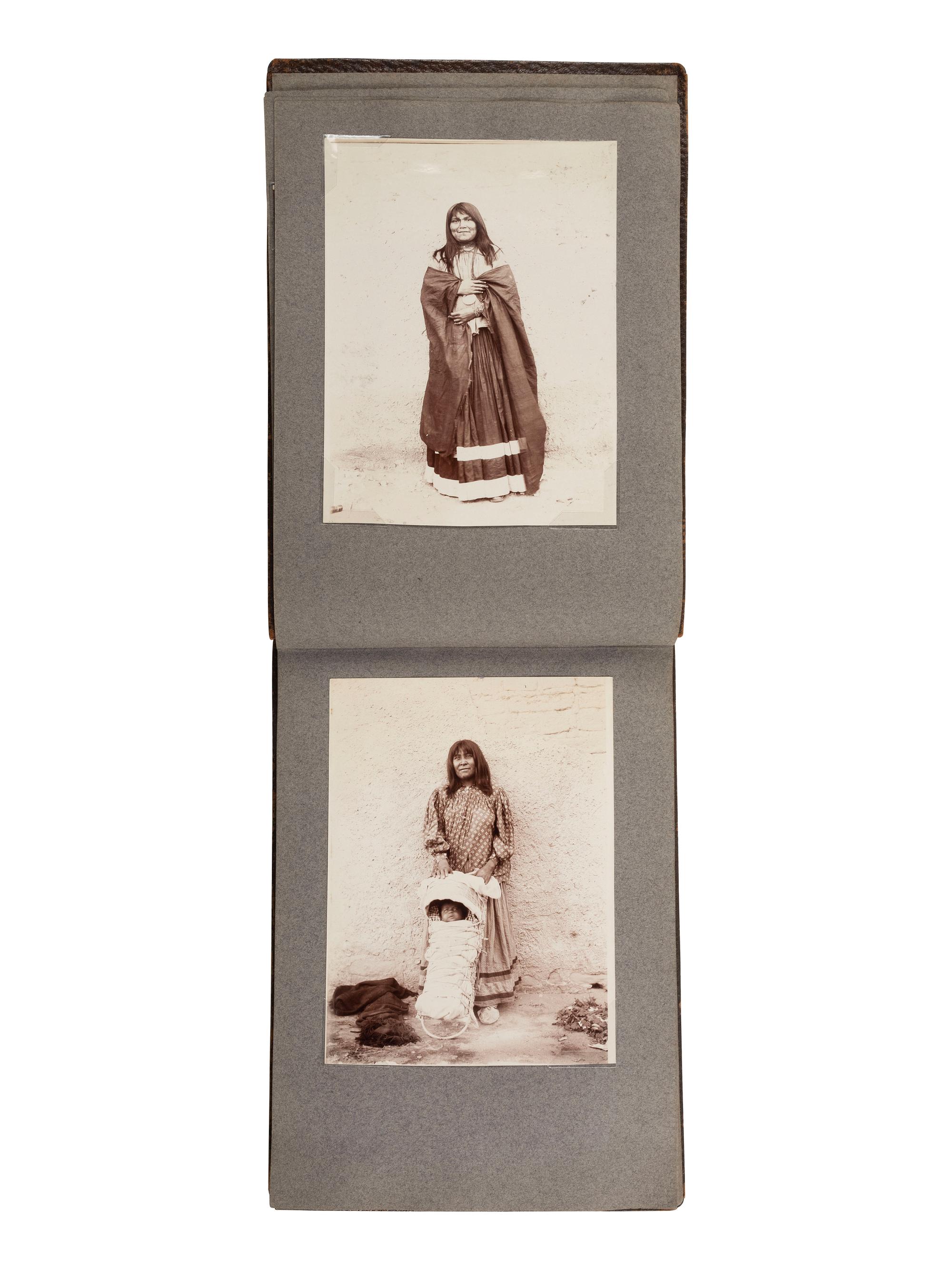[NATIVE AMERICANS]. JONES, John Edward (1863-1922), photographer. Album containing 50 photographs of the San Carlos Indian Agency, including Apache civilians and police, agency buildings and dwellings, and scenic views. Ca 1904.
