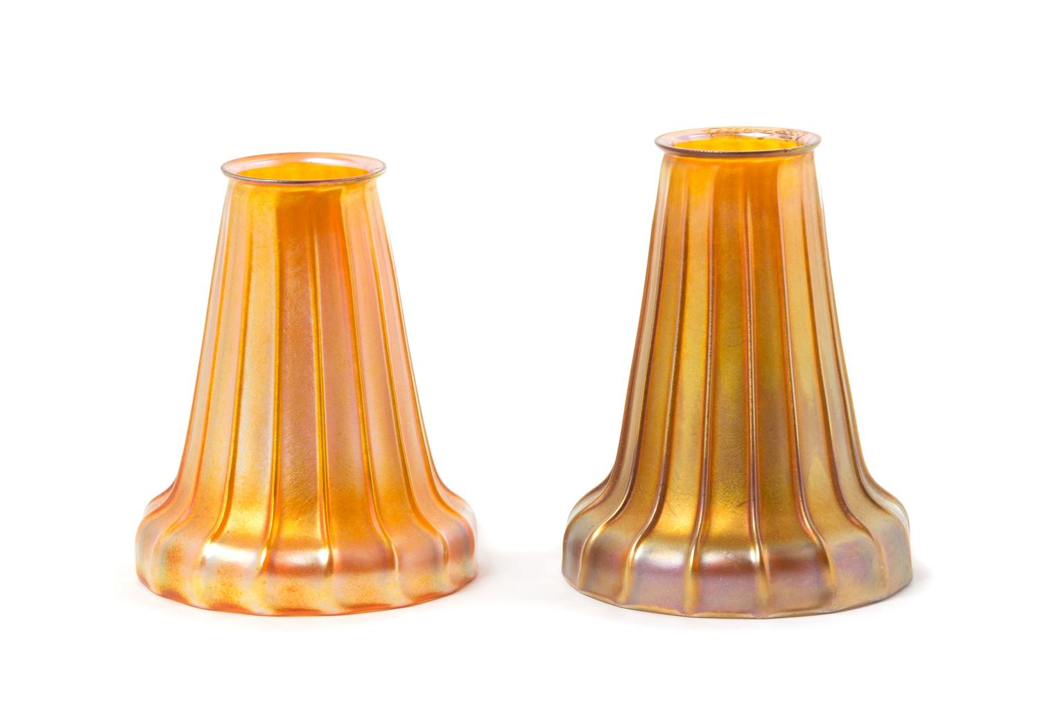 Quezal, EARLY 20TH CENTURY, a pair of glass shades, each with ribbed decoration, together with a brass two-light fixture