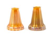 Quezal, EARLY 20TH CENTURY, a pair of glass shades, each with ribbed decoration, together with a brass two-light fixture